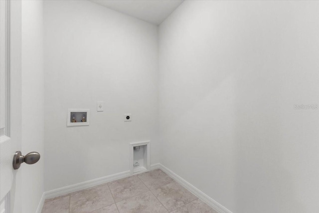 laundry room with light tile patterned flooring, washer hookup, and hookup for an electric dryer