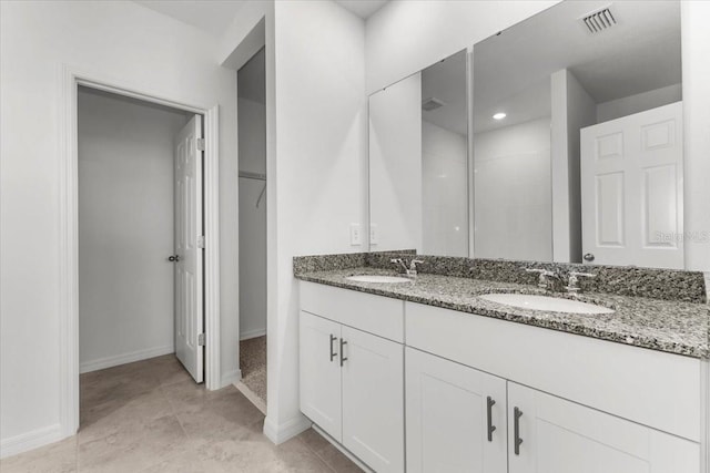 bathroom with vanity and tile patterned flooring