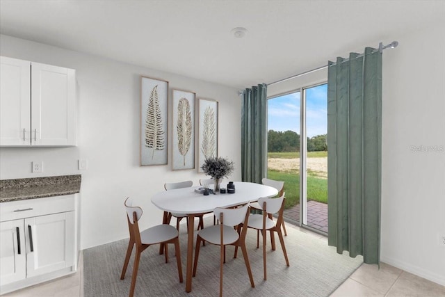 dining room featuring light tile patterned floors