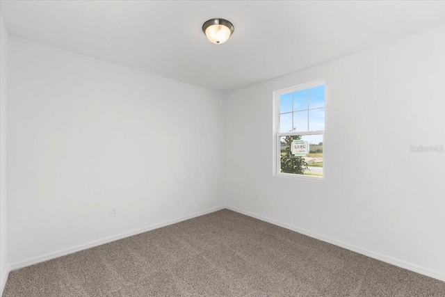 2466 Leeds St, Haines City, FL 33844 - spare room featuring baseboards and carpet flooring