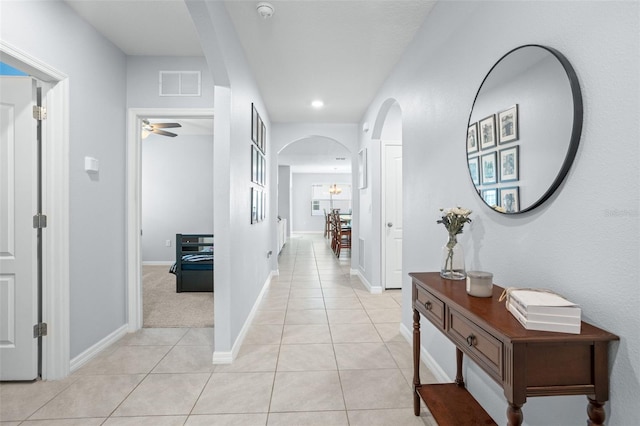 corridor with light tile flooring