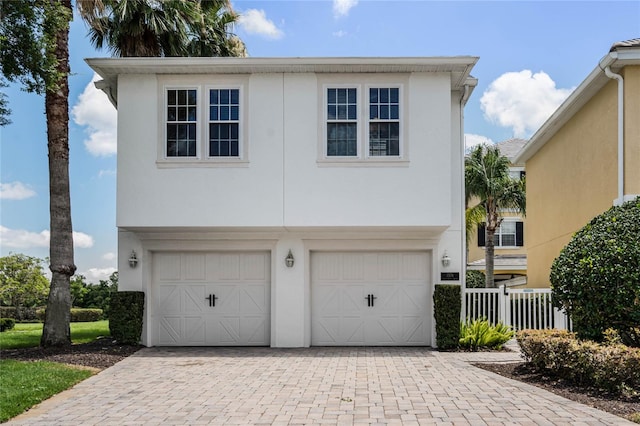 view of front of home with a garage