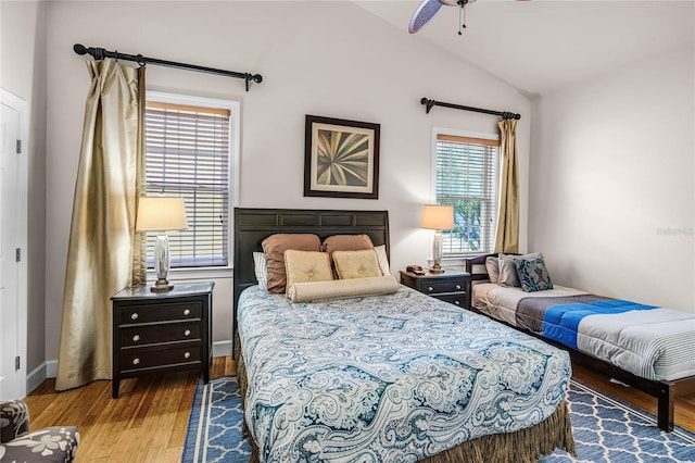 bedroom featuring lofted ceiling, ceiling fan, and hardwood / wood-style floors