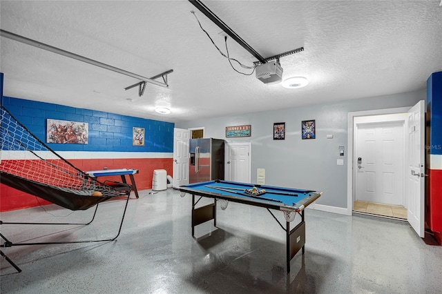 recreation room featuring billiards and a textured ceiling