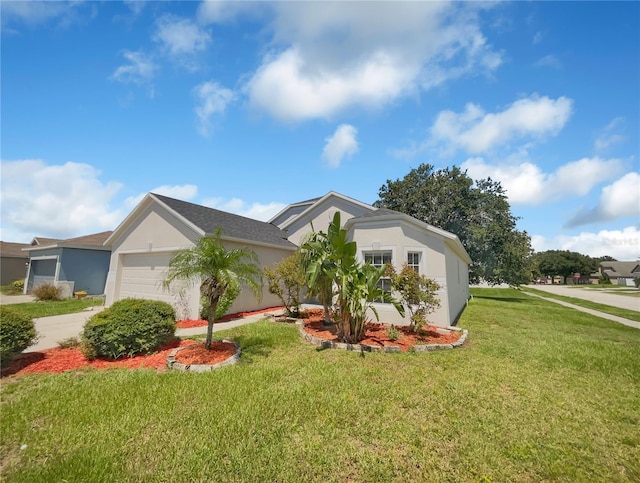 205 Hibiscus St, Winter Haven, FL 33881 - view of front of house featuring an attached garage, driveway, a front yard, and stucco siding