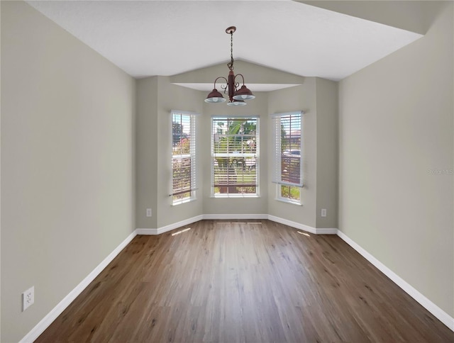 205 Hibiscus St, Winter Haven, FL 33881 - unfurnished dining area with baseboards, a notable chandelier, and dark wood finished floors