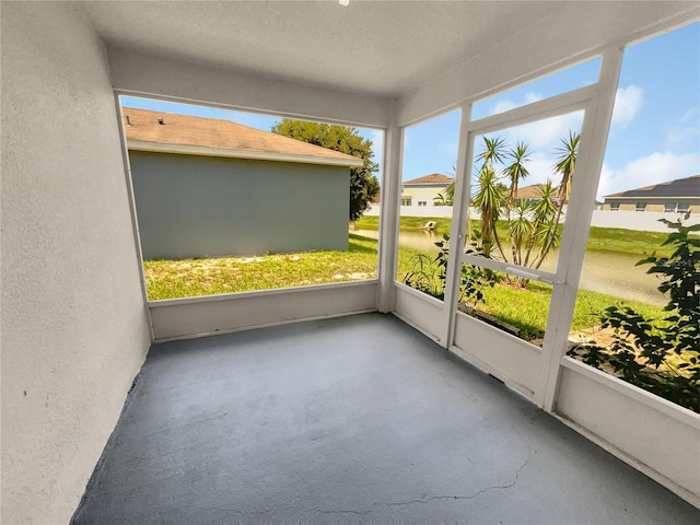205 Hibiscus St, Winter Haven, FL 33881 - unfurnished sunroom featuring a wealth of natural light and a residential view