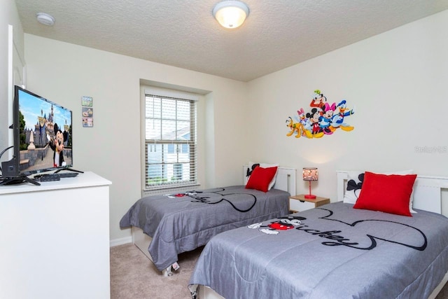 carpeted bedroom with a textured ceiling