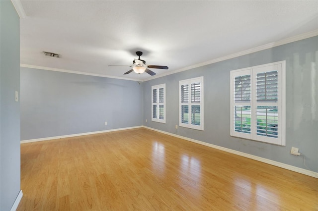 spare room with light hardwood / wood-style floors, crown molding, and ceiling fan