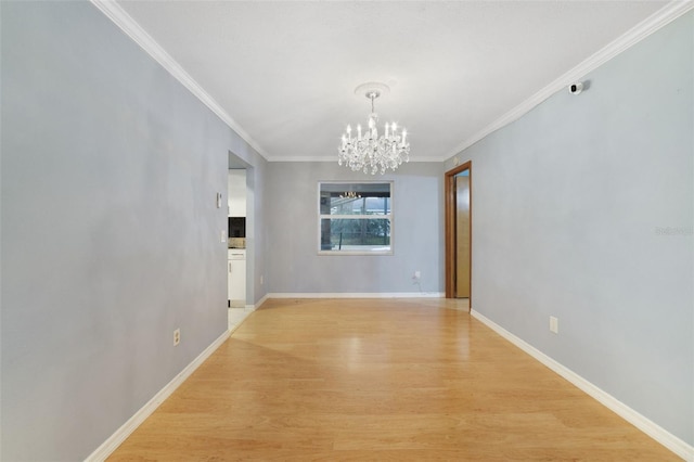 unfurnished dining area with crown molding, an inviting chandelier, and light hardwood / wood-style flooring