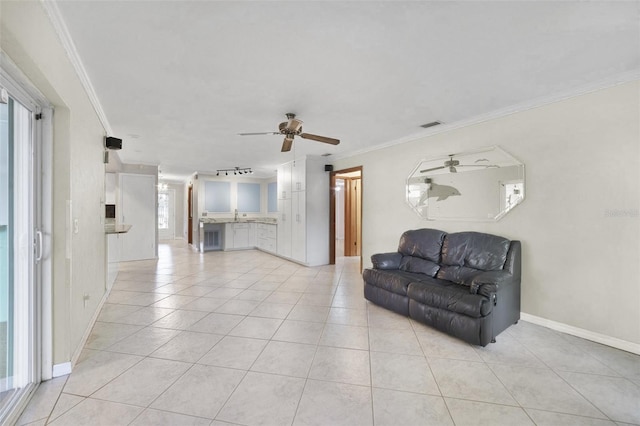 living room with ceiling fan, light tile patterned floors, and ornamental molding