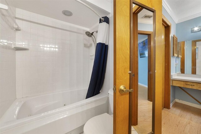 full bathroom featuring wood-type flooring, crown molding, vanity, shower / bath combo, and toilet