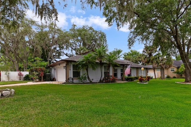 ranch-style home with a garage and a front lawn