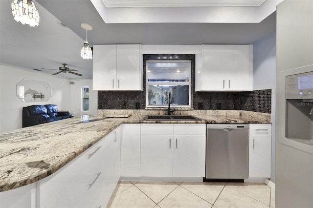 kitchen featuring stainless steel dishwasher, pendant lighting, decorative backsplash, and ornamental molding