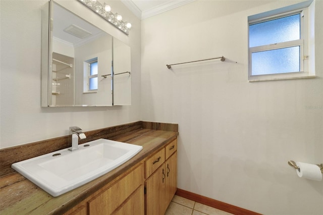 bathroom featuring crown molding, tile patterned flooring, and vanity