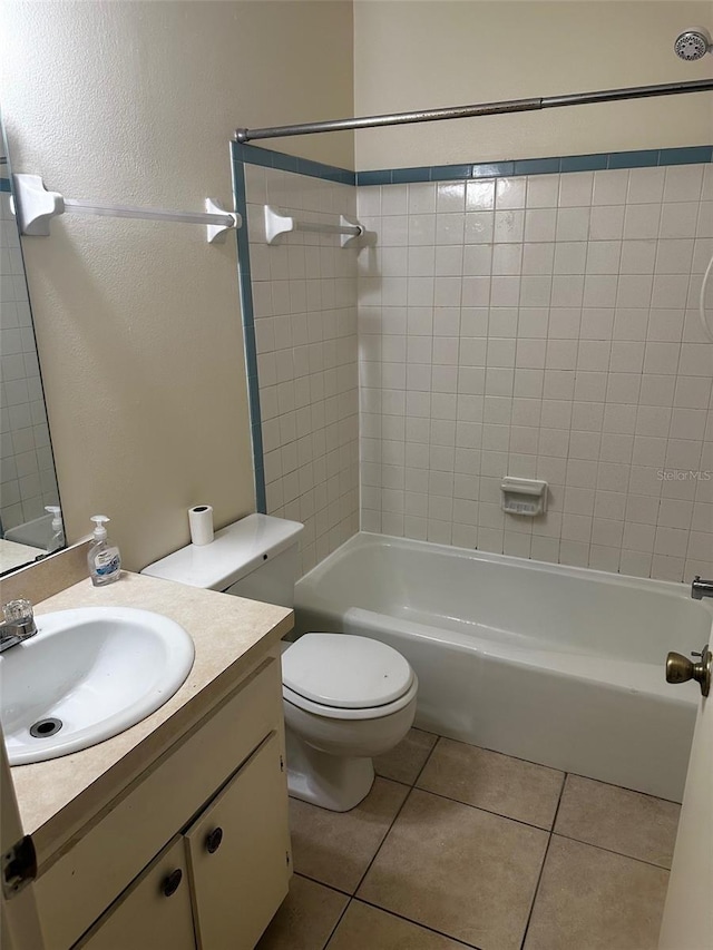 bathroom with shower / bath combination, vanity, toilet, and tile patterned floors