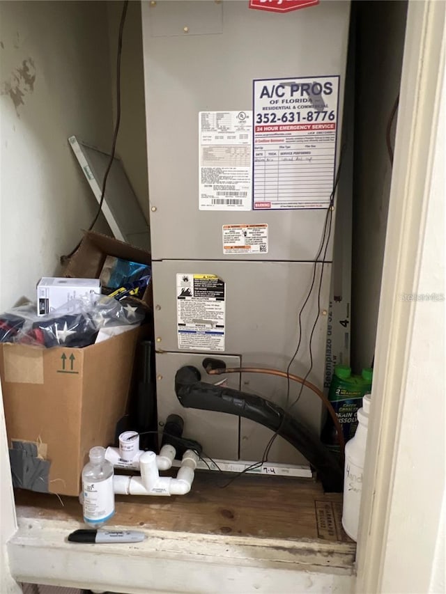 utility room featuring heating unit