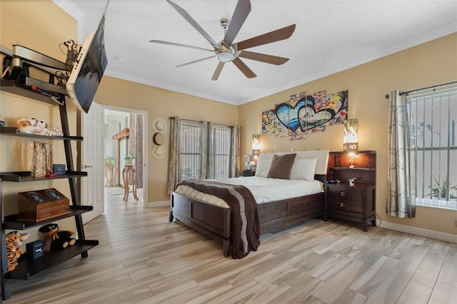 bedroom with crown molding, a textured ceiling, light hardwood / wood-style floors, and ceiling fan