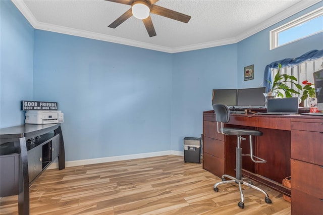 office space with a textured ceiling, ornamental molding, light wood-type flooring, and ceiling fan