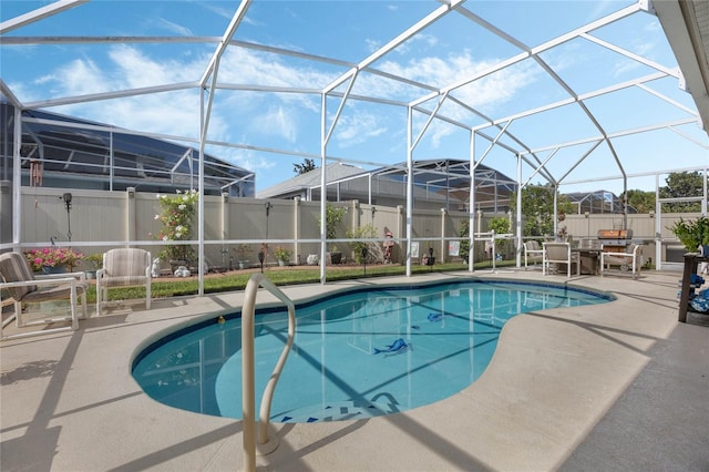 view of pool with a lanai and a patio area