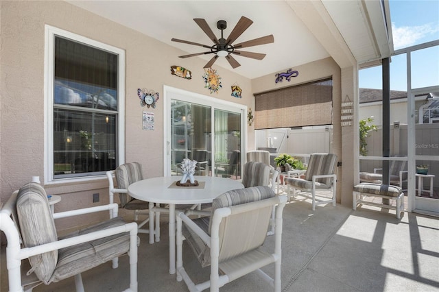 exterior space featuring ceiling fan