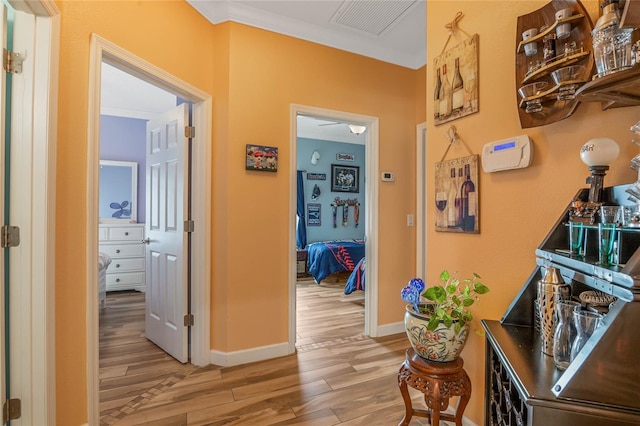 hallway with light hardwood / wood-style flooring