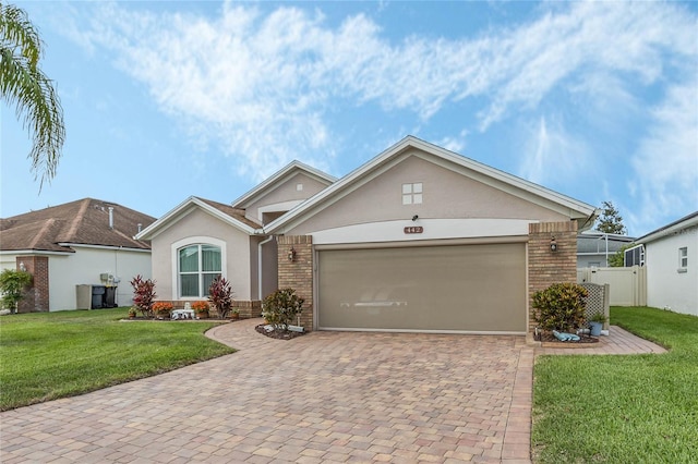 view of front facade with a front yard and a garage