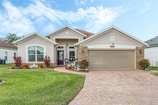 single story home featuring a garage, a front yard, and central air condition unit