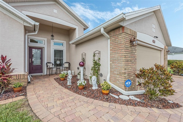 doorway to property featuring a garage