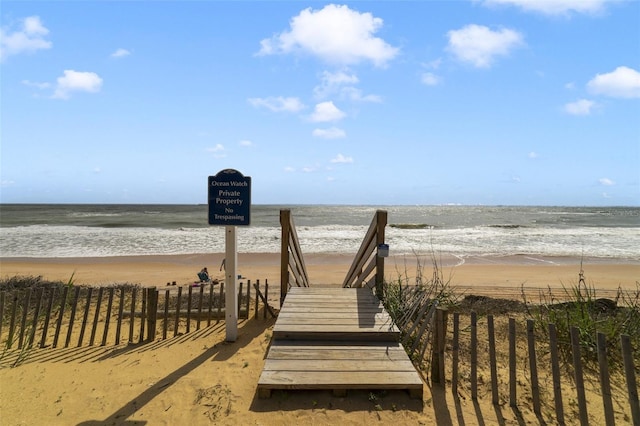 view of home's community with a view of the beach and a water view