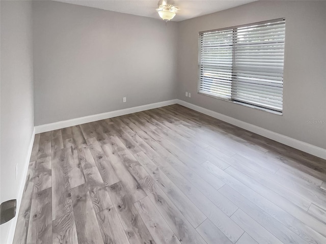 spare room with light hardwood / wood-style flooring