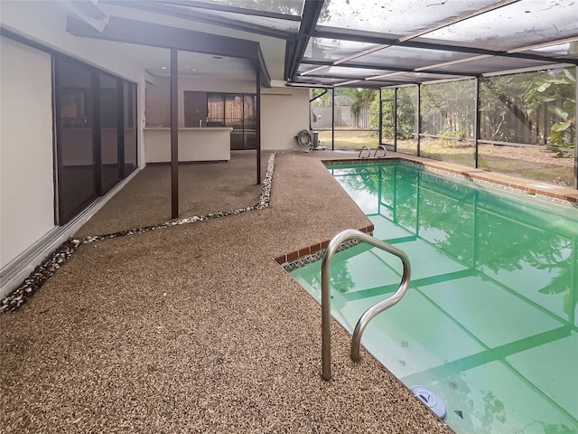 view of swimming pool with a lanai and a patio area