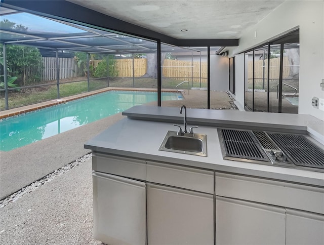 view of swimming pool featuring sink