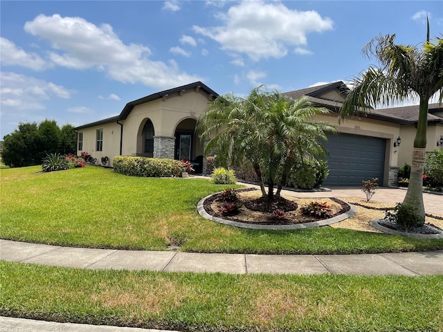 view of front of house with a front yard and a garage