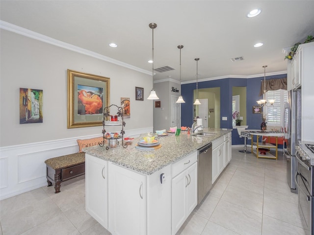 kitchen with a sink, appliances with stainless steel finishes, visible vents, light tile patterned flooring, and ornamental molding