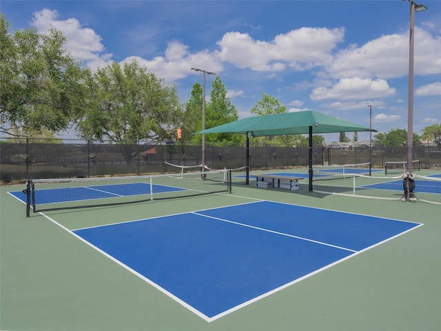 view of sport court featuring fence and community basketball court
