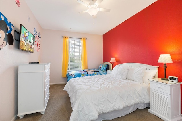 bedroom with dark colored carpet and ceiling fan