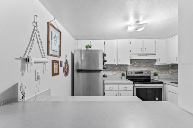 kitchen featuring white cabinetry, a textured ceiling, stainless steel appliances, backsplash, and custom exhaust hood