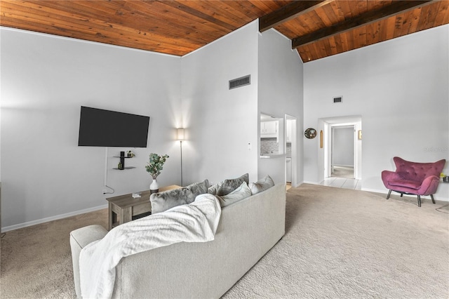 carpeted living room featuring high vaulted ceiling and wooden ceiling