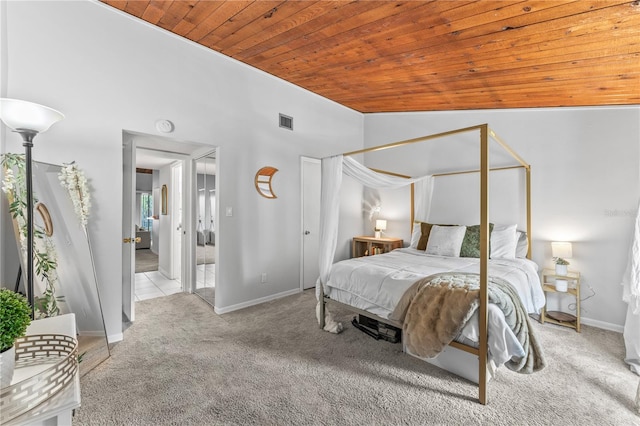 bedroom featuring wooden ceiling, lofted ceiling, and carpet