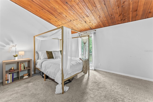 carpeted bedroom featuring wooden ceiling and ornamental molding