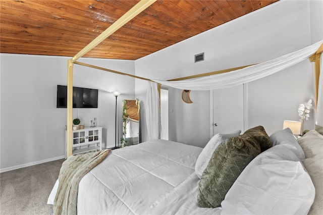 bedroom featuring carpet, wood ceiling, and lofted ceiling