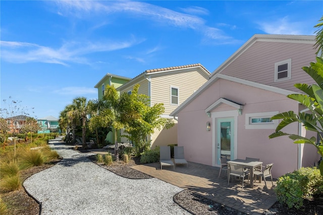 rear view of property with a patio