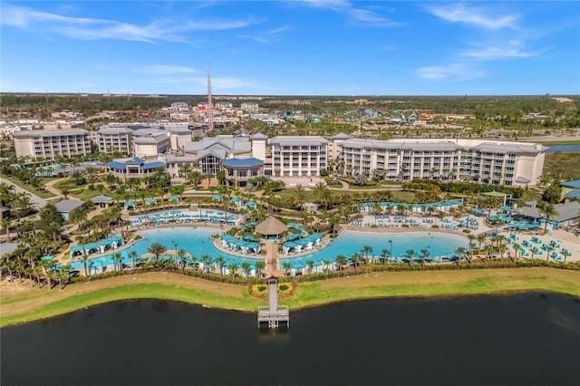 birds eye view of property with a water view