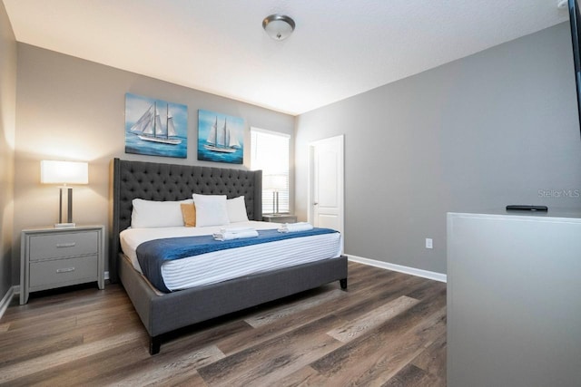 bedroom featuring dark hardwood / wood-style floors