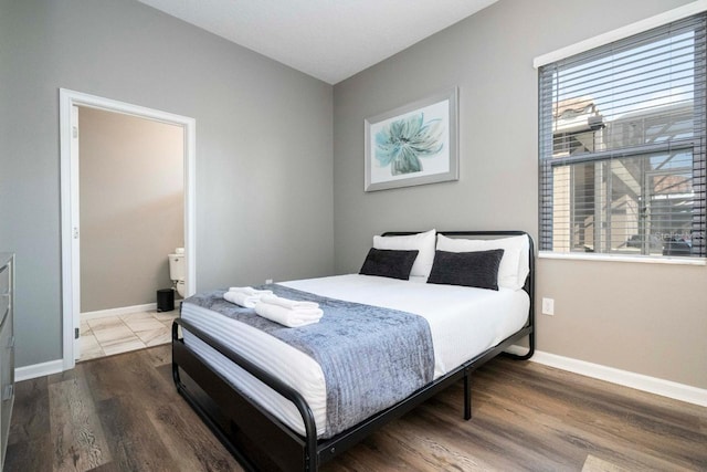 bedroom with hardwood / wood-style floors