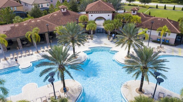 view of swimming pool with a lawn and a patio area