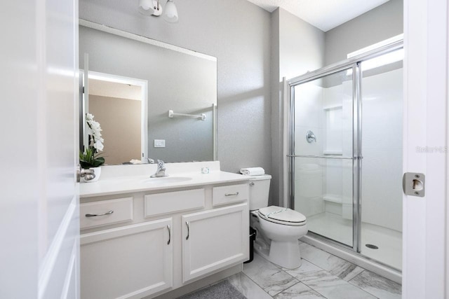 bathroom with tile flooring, vanity, toilet, and a shower with door