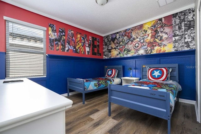 bedroom featuring a textured ceiling and dark wood-type flooring