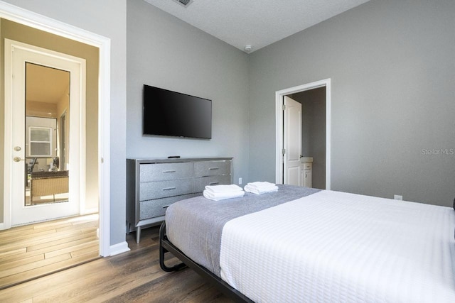 bedroom featuring wood-type flooring